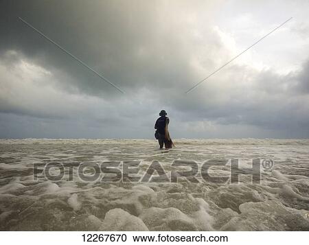 Burmese fisherman on Thai beach; Ranong, Thailand View Large Photo Image Stock Image - Burmese fisherman on Thai beach; Ranong, Thailand. Fotosearch