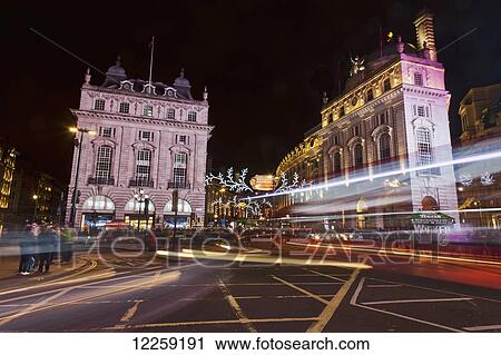 Bus and car headlight trails, Piccadilly Circus; London, England View Large Photo Image Stock Image - Bus and car headlight trails, Piccadilly Circus; London, England. Fotosearch