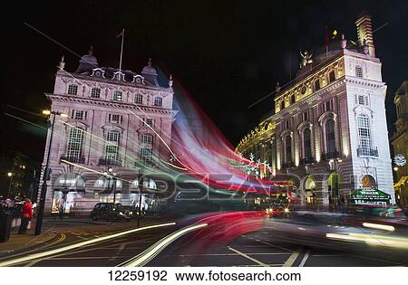 Bus and car headlight trails, Piccadilly Circus; London, England View Large Photo Image Stock Image - Bus and car headlight trails, Piccadilly Circus; London, England. Fotosearch