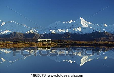 Bus Passes By Tundra Pond With Reflection Of The Alaska Range; Alaska, Usa View Large Photo Image Stock Photograph - Bus Passes By Tundra Pond With Reflection Of The Alaska Range; Alaska, Usa. Fotosearch