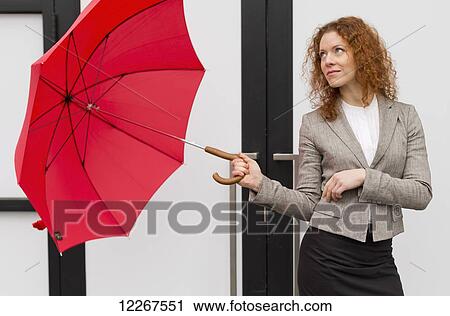Businesswoman with a red umbrella; Abbotsford, British Columbia, Canada View Large Photo Image Stock Image - Businesswoman with a red umbrella; Abbotsford, British Columbia, Canada. Fotosearch