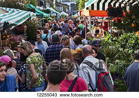 Stock Image - Busy Columbia Road Flower Market; London, England. Fotosearch