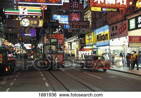 Busy Night Street Scene With Neon Signs View Large Photo Image Stock Photograph - Busy Night Street Scene With Neon Signs. Fotosearch