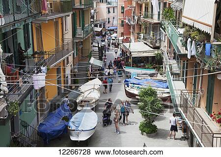 Busy streets of Manarola with people and boats; Manarola, Liguria, Italy View Large Photo Image Stock Photo - Busy streets of Manarola with people and boats; Manarola, Liguria, Italy. Fotosearch