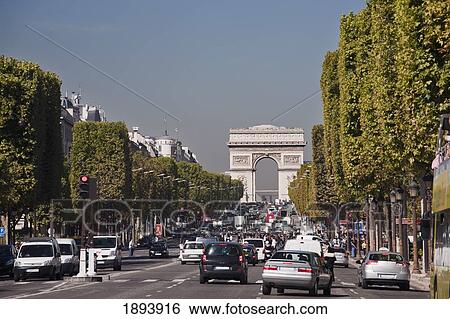 Busy Vehicle Traffic With The Arc De Triomphe In The Background; Paris, France View Large Photo Image Stock Photograph - Busy Vehicle Traffic With The Arc De Triomphe In The Background; Paris, France. Fotosearch