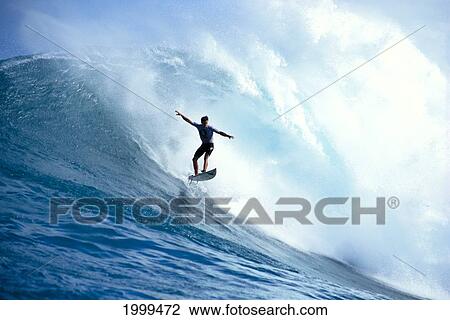 Stock Image - Buzzy Kerbox Airborne, Huge Crashing Wave. Fotosearch