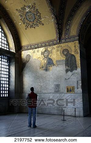 Stock Image - Byzantine Mosaic And Awed Spectator, The Interior Of Ayia Sophia, Sultanahmet, Istanbul, Turkey. Fotosearch