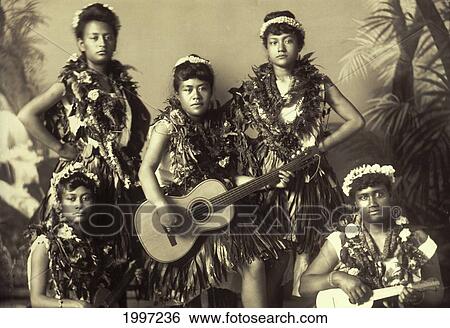 Stock Photograph - C. 1900-1920 Hawaiian Culture Group Of Hula Dancers, Few With Instruments, Black And White Picture. Fotosearch