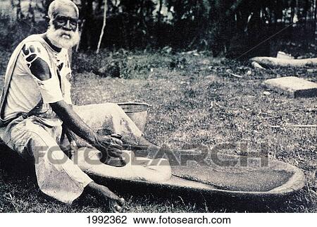 C. 1900 Black And White Photograph, Hawaiian Man Pounding Poi View Large Photo Image Stock Image - C. 1900 Black And White Photograph, Hawaiian Man Pounding Poi. Fotosearch