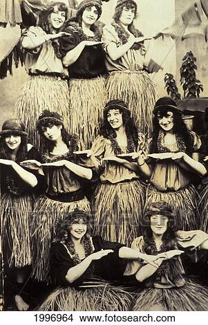 Picture - C. 1935 Group Of Caucasian Women In Hula Attire, Posing In Rows, Black/White, Close-Up Postcard. Fotosearch