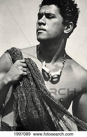 Stock Photo - C. 1938 Hawaii, Portrait Of Local Throw Net Fisherman With Net Over Shoulder. Fotosearch