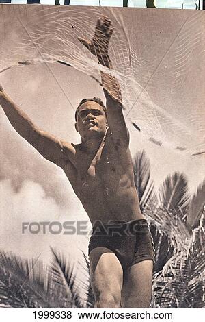 Stock Photo - C. 1938 Photograph Black And White: Local Kane (Male) Throwing Net Fishing B1440. Fotosearch