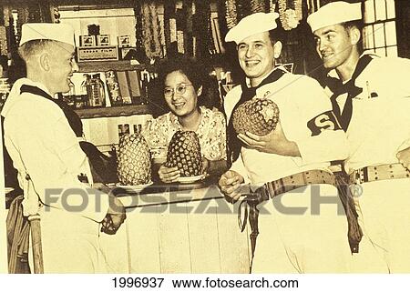 Stock Photo - C. 1940 Hawaii, Maui, Lahaina, Black And White, Hawaiian Woman Selling Pineapples To Soldiers. Fotosearch