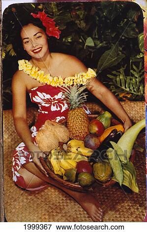 C. 1955 Pretty Hawaiian Woman Holding Basket Of Fruit, Sits On Lauhala Mat, Smiling C1515 View Large Photo Image Stock Photo - C. 1955 Pretty Hawaiian Woman Holding Basket Of Fruit, Sits On Lauhala Mat, Smiling C1515. Fotosearch