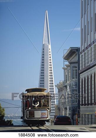 Cable Car Going Down Washington Street On Nob Hill With The Trans-America Pyramid Behind View Large Photo Image Stock Photo - Cable Car Going Down Washington Street On Nob Hill With The Trans-America Pyramid Behind. Fotosearch