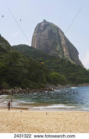 Cable car to Sugarloaf from the beach at Praia Vermelha; Rio de Janeiro, Brazil View Large Photo Image Stock Image - Cable car to Sugarloaf from the beach at Praia Vermelha; Rio de Janeiro, Brazil. Fotosearch