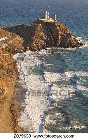 Cabo De Gata-Nijar Natural Park The Lighthouse And Communications Apparatus On The Headland; Cabo De Gata Almeria Province Spain View Large Photo Image Stock Photo - Cabo De Gata-Nijar Natural Park The Lighthouse And Communications Apparatus On The Headland; Cabo De Gata Almeria Province Spain. Fotosearch