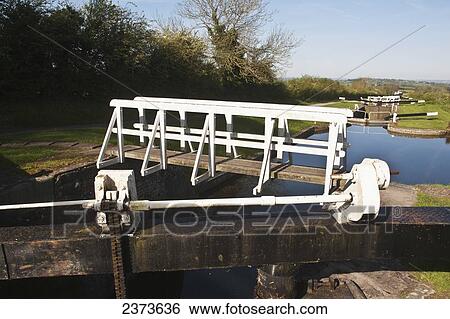 Caen Hill Locks on Kennet and Avon Canal; Wiltshire, England View Large Photo Image Stock Photograph - Caen Hill Locks on Kennet and Avon Canal; Wiltshire, England. Fotosearch