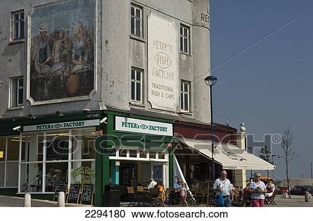 Stock Image - Cafe society, with waterfront bars and restaurants overlooking the marina; Ramsgate, Thanet, Kent, England. Fotosearch