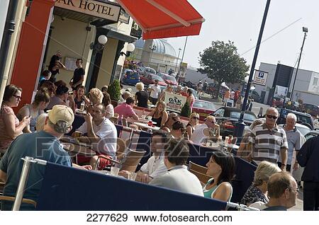 Stock Photo - Cafe society, with waterfront bars and restaurants overlooking the marina; Ramsgate, Thanet, Kent, England. Fotosearch