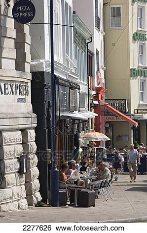 Cafe society, with waterfront bars and restaurants overlooking the marina; Ramsgate, Thanet, Kent, England View Large Photo Image Stock Photograph - Cafe society, with waterfront bars and restaurants overlooking the marina; Ramsgate, Thanet, Kent, England. Fotosearch