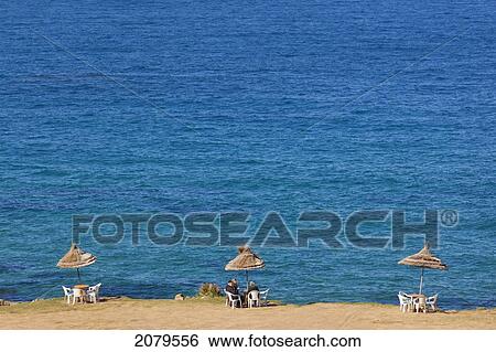 Cafe Umbrellas And Tables On Cliff Edge At Plage Cape Spartel Near Tangiers; Morocco View Large Photo Image Stock Photograph - Cafe Umbrellas And Tables On Cliff Edge At Plage Cape Spartel Near Tangiers; Morocco. Fotosearch