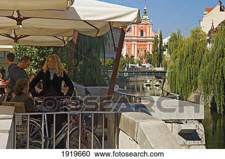 Stock Image - Cafes Along The Riverside, Ljubljana, Slovenia. Fotosearch