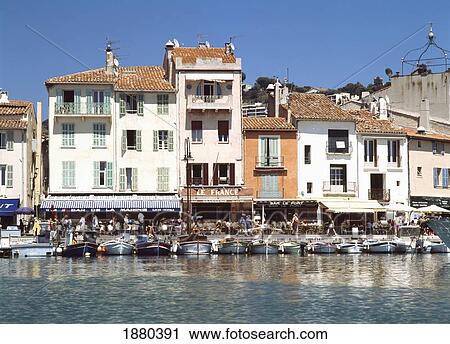 Stock Image - Cafes And Boats On Waterfront Of Cassis Near Marseille. Fotosearch