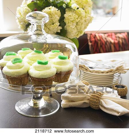Stock Image - Cake Plate With Lime Cupcakes; Victoria Vancouver Island British Columbia Canada. Fotosearch