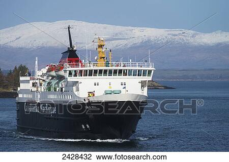 Stock Image - Caledonian MacBrayne ferry coming into Oban port in winter; Oban, Argyll and Bute, Scotland. Fotosearch