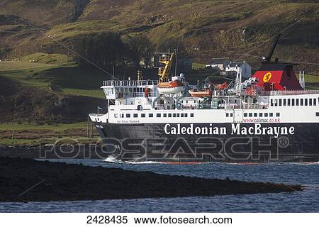 Stock Photography - Caledonian MacBrayne ferry, going along narrow channel between mainland and Kerrera Island having just left Oban port; Oban, Argyll and Bute, Scotland. Fotosearch