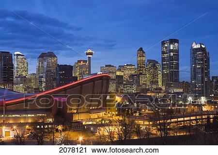 Calgary Skyline With Saddledome At Dusk With City Lights; Calgary Alberta Canada View Large Photo Image Stock Image - Calgary Skyline With Saddledome At Dusk With City Lights; Calgary Alberta Canada. Fotosearch