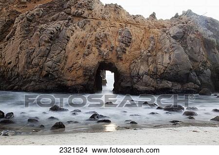 California, Big Sur, Pfeiffer Beach, Close Up View Of Arch In Rock Formation, Long Exposure. View Large Photo Image Picture - California, Big Sur, Pfeiffer Beach, Close Up View Of Arch In Rock Formation, Long Exposure.. Fotosearch