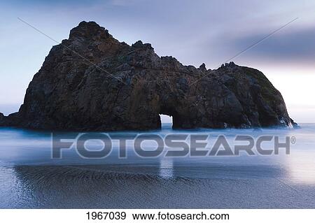 Stock Photo - California, Big Sur, The Window At Pfeiffer Burns Beach At Sunset, Long Exposure. Fotosearch