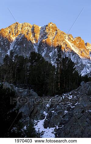 Stock Image - California, Eastern Sierras, Beautiful Snow Capped Mountains At Sunrise.. Fotosearch
