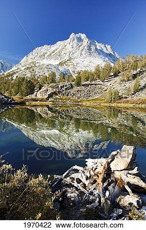 Stock Image - California, Eastern Sierras, Beautiful Mountain Lake Scene With Dramatic Snowy Peaks. Fotosearch