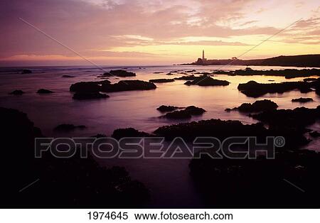 Stock Photography - California, Highway 1, Rocky Seascape And Cabrillo Lighthouse At Sunset.. Fotosearch
