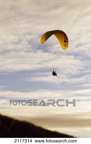 California, La Jolla, Paraglider flying in front of vibrant sunset. EDITORIAL USE ONLY. View Large Photo Image Picture - California, La Jolla, Paraglider flying in front of vibrant sunset. EDITORIAL USE ONLY.. Fotosearch