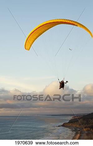 California, La Jolla, Paragliders Flying Over The Coast Holding Bird. For Editorial Use Only. View Large Photo Image Stock Photo - California, La Jolla, Paragliders Flying Over The Coast Holding Bird. For Editorial Use Only.. Fotosearch