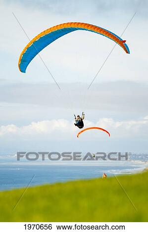 California, La Jolla, Paragliders Flying Over The Coast. For Editorial Use Only. View Large Photo Image Stock Photograph - California, La Jolla, Paragliders Flying Over The Coast. For Editorial Use Only.. Fotosearch