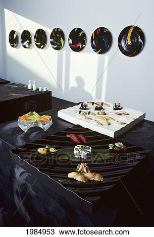 Stock Image - California, Los Angeles, Food Laid Out On Table At Sushi Restaurant.. Fotosearch