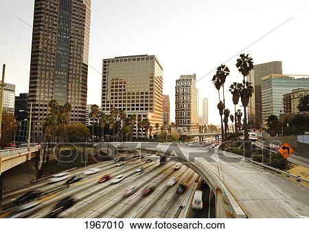 Stock Image - California, Los Angeles, Freeway Traffic In Downtown La At Sunset, Long Exposure. Fotosearch