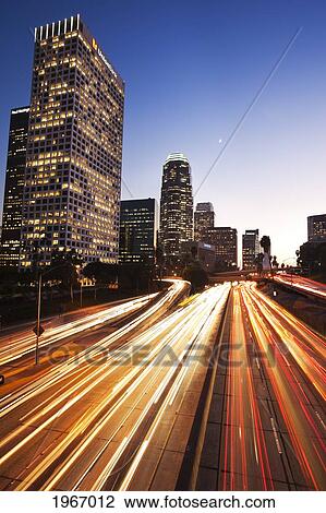 Stock Image - California, Los Angeles, Freeway Traffic In Downtown La At Nightfall. Fotosearch