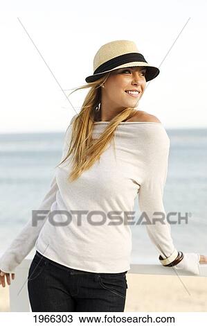Stock Image - California, Malibu, Outdoor Portrait Of Beautiful Blond Woman Along Coast.. Fotosearch