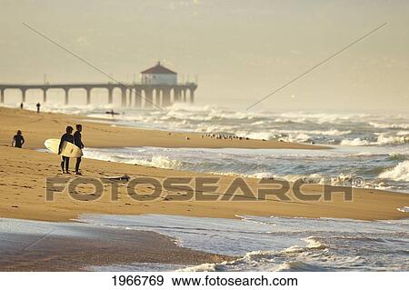 Stock Photo - California, Manhattan Beach, Surfers On The Shoreline Checking The Waves. Fotosearch