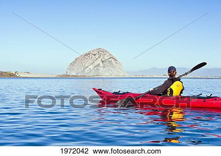California, Morro Bay State Park, Woman Kayaking With Morro Rock In Distance. View Large Photo Image Stock Image - California, Morro Bay State Park, Woman Kayaking With Morro Rock In Distance.. Fotosearch
