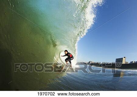 California, Redondo Beach, Surfer In The Barrel Riding Large Wave. For Editorial Use Only. View Large Photo Image Stock Image - California, Redondo Beach, Surfer In The Barrel Riding Large Wave. For Editorial Use Only.. Fotosearch
