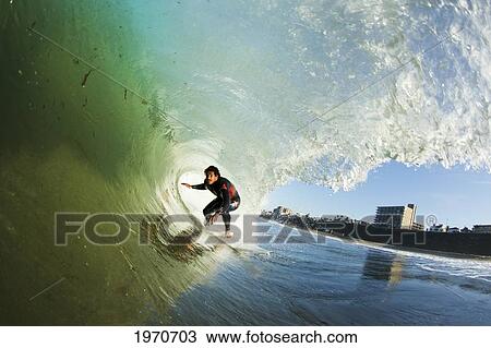 California, Redondo Beach, Surfer In The Barrel Riding Large Wave. For Editorial Use Only. View Large Photo Image Stock Image - California, Redondo Beach, Surfer In The Barrel Riding Large Wave. For Editorial Use Only.. Fotosearch