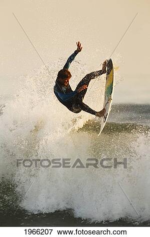 California, San Clemente, Surfer Catching Air On Wave, Evening Light. Editorial Use Only. View Large Photo Image Stock Photo - California, San Clemente, Surfer Catching Air On Wave, Evening Light. Editorial Use Only.. Fotosearch