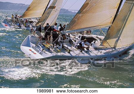 Stock Image - California, San Francisco, Big Boat Series, Side Stern View Of Two Yachts, Upwind Tactics, One Design. Fotosearch